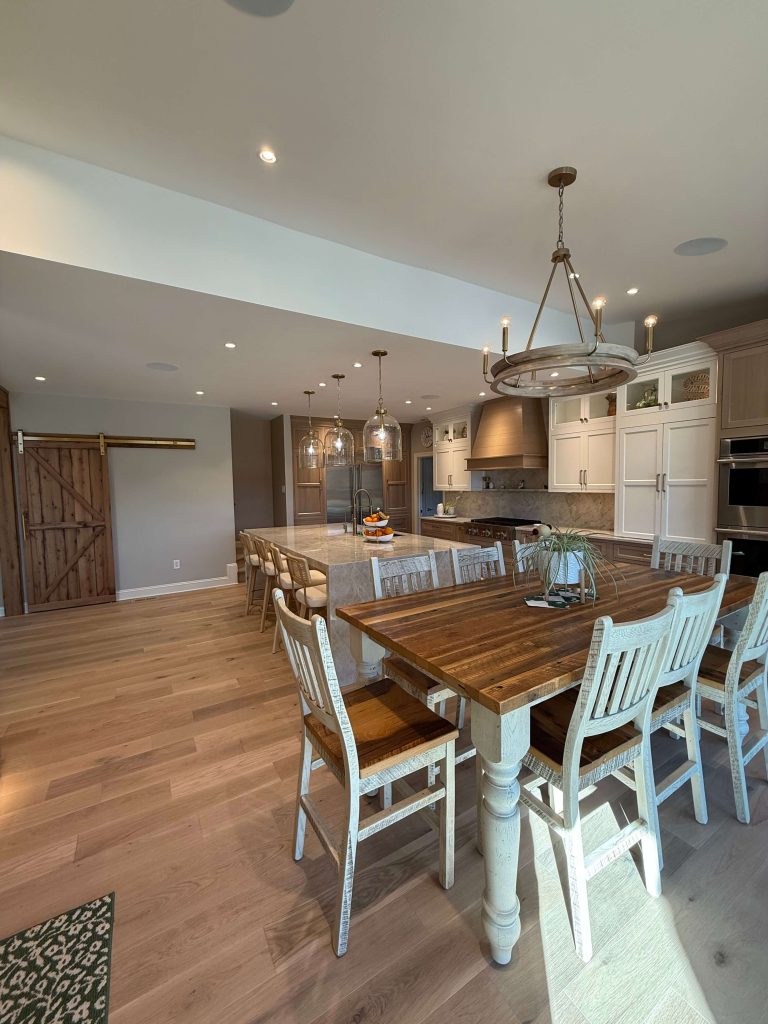 Open kitchen and dining remodel with reclaimed wood table, barn door and custom island in South Jersey