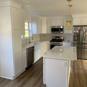 Full kitchen remodel with white cabinets, quartz island and farmhouse sink in Gloucester County NJ