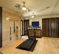 Basement with gym equipment and wooden floor